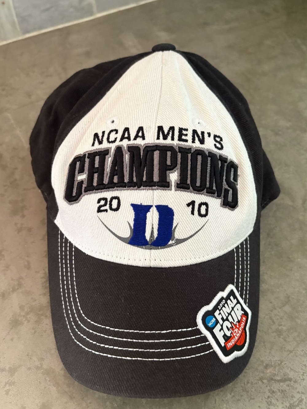 Duke NCAA Men's Champions 2010 Baseball Cap - Black & White with Blue Logo